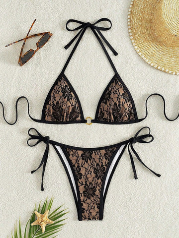 Black lace halter top with floral pattern and nude bikini